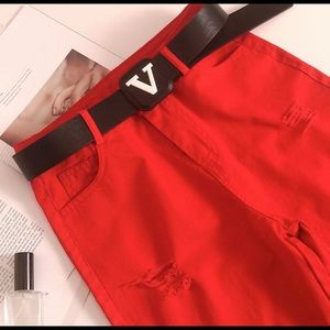 Pastel red skinny ripped jeans